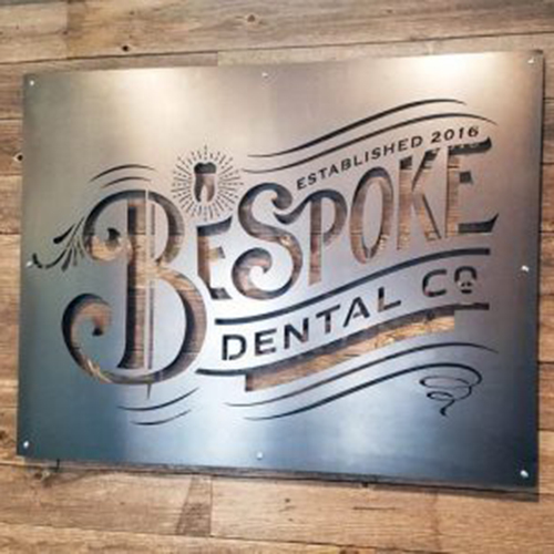 Bespoke Dental Co Lasercut Steel Signage with Exposed Fasteners 400x300 (Edited)